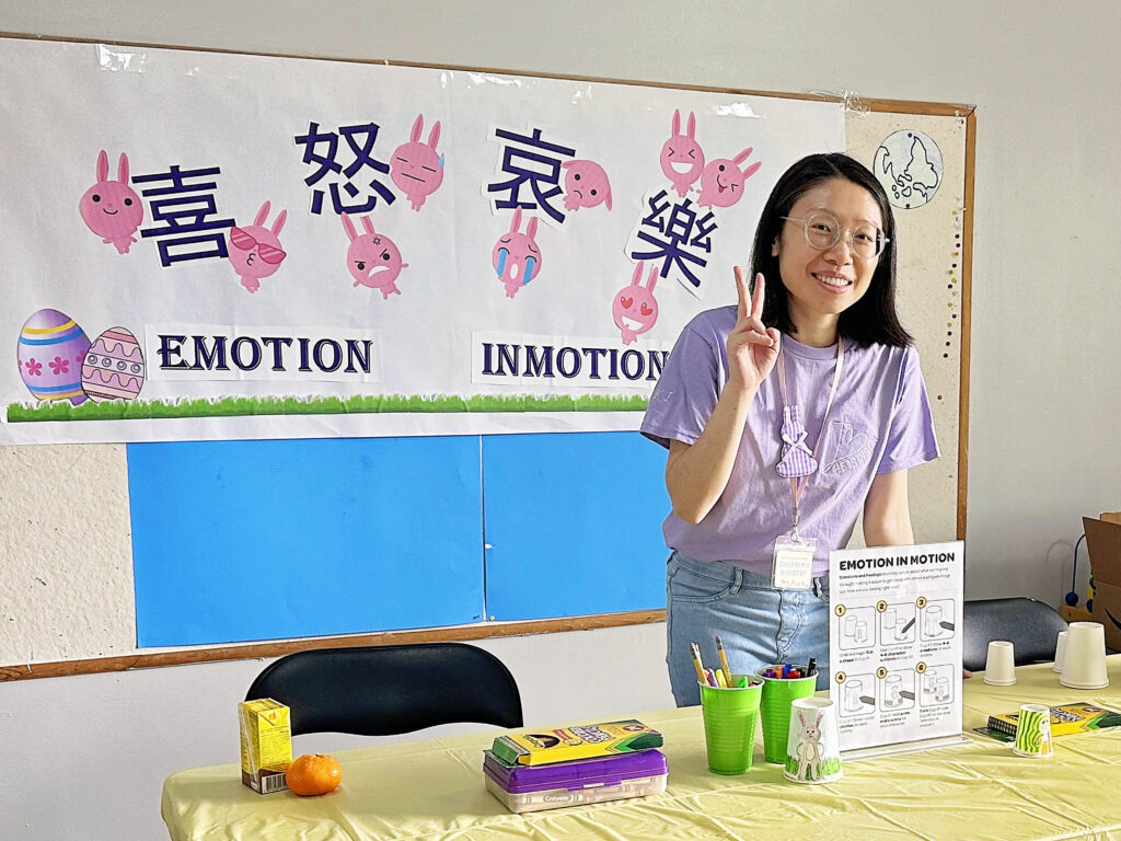 Ki in front of her booth, "Emotions in Motion" at CABC